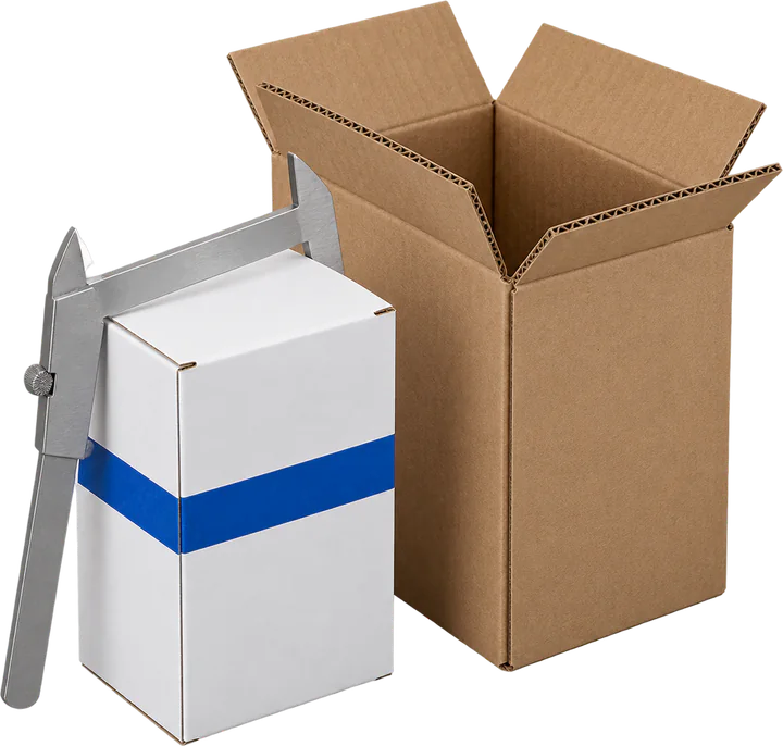 Folding carton and corrugated case beside a measuring caliper
