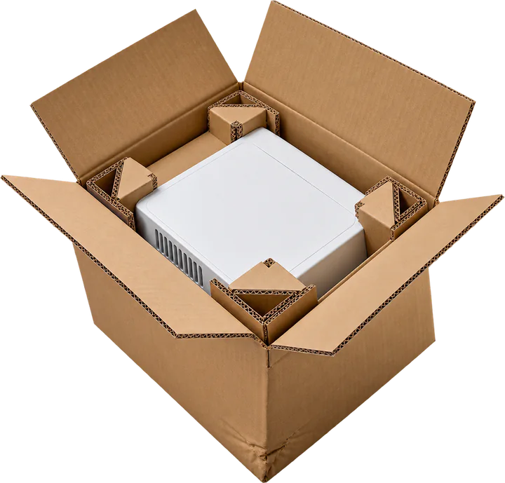 Open shipping box with protective inserts around a packed product